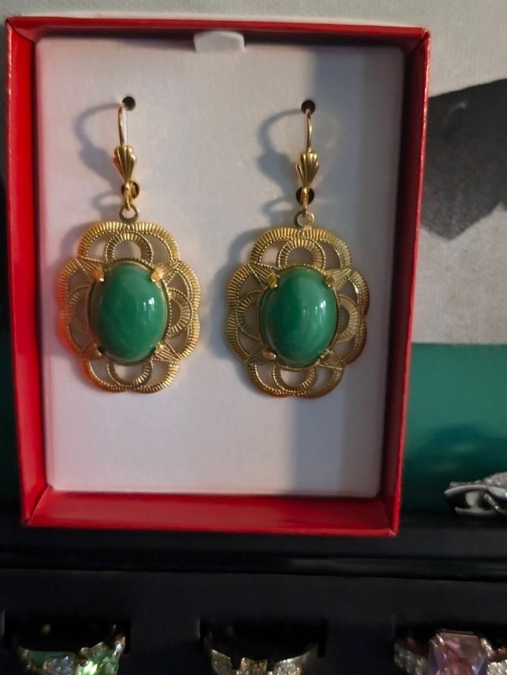 Gold tone jade earrings